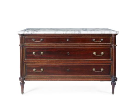A late 19th Century French walnut commode with marble top above three graduated long drawers with fluted column sides, raised