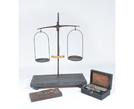 A set of chemist scales with two sets of weights