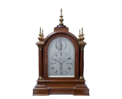 An oak boardroom bracket clock the arched silvered Roman dial signed Thomas Gammage & Son from James McCabe's, 1 St Michaels 