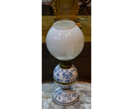 A continental blue onion pattern porcelain oil lamp with opaque shade, 55cm