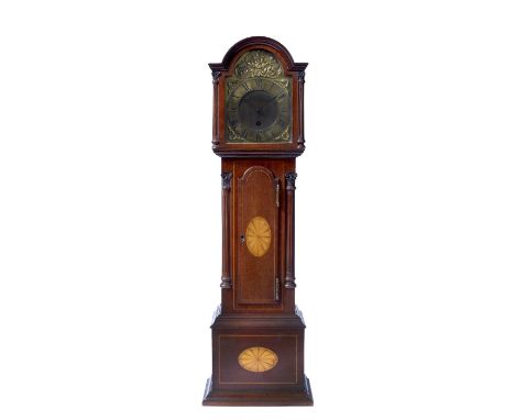 An Edwardian mahogany miniature longcase clock the break arch brass dial with Roman chapter ring and matted centre, the timep