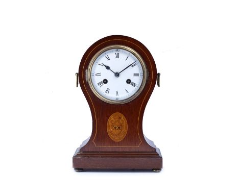 A mahogany and inlaid balloon cased mantel clock with convex white enamel Roman dial, the twin train movement with coiled gon