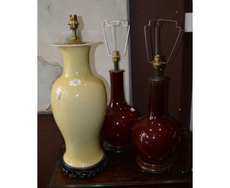 Three contemporary Chinese table lamp bases to include two sang-de-boeuf and one of pale yellow ground, largest 49.5cm