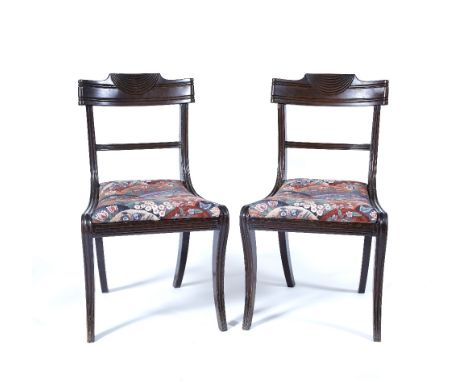A pair of William IV carved dining chairs together with a jardiniere stand and a mahogany standard lamp