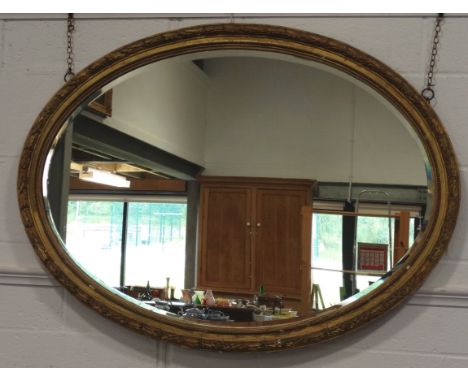 LARGE OVAL GILT FRAMED MIRROR 