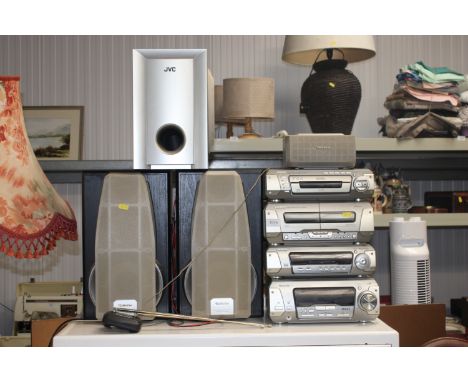 A Technics stack comprising stereo cassette deck, a compact disc changer, sound processor, stereo tuner amplifier, a pair of 