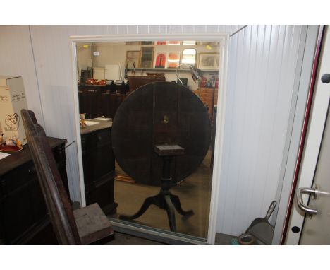 A white framed bevel edged wall mirror 