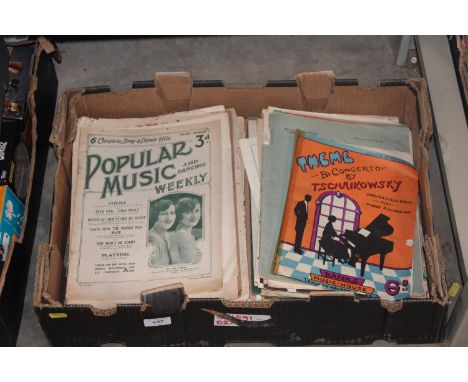 A box containing various sheet music 