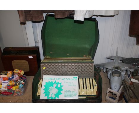 A Hohner Tango V piano accordion in fitted case AF