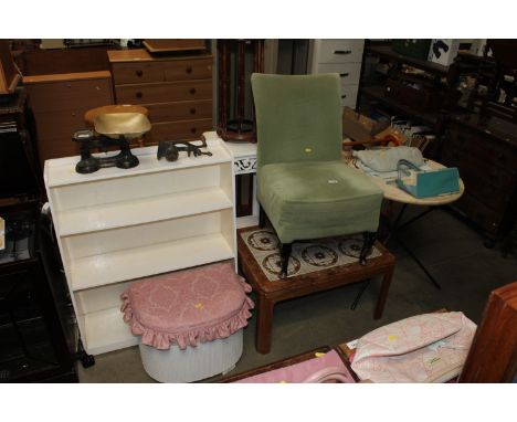 A modern circular occasional table, a tile topped coffee table, an upholstered chair, a Loom storage basket and a white paint