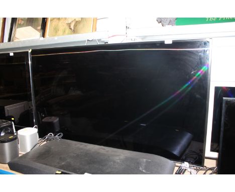 A Samsung 55" curved flat screen television and remote control 