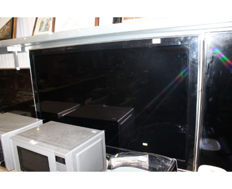 A Samsung 46" flat screen television with remote control 