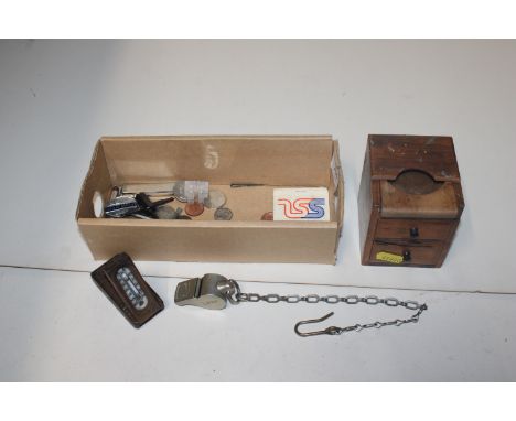 A box containing various coinage; a wooden apprentice piece; a whistle; and a Lauterbrunen thermometer