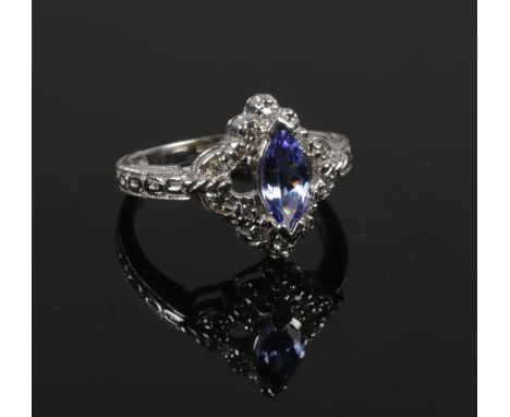 A 14ct white gold marquis tanzanite and diamond ring. Size O.&nbsp;(4.32g).