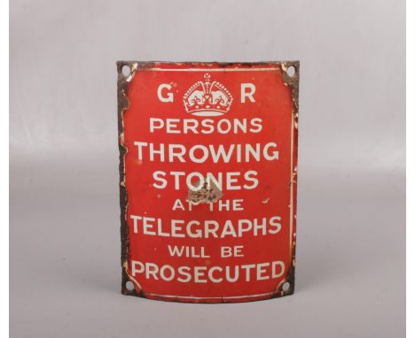 A George V enameled concave telegraph pole warning sign. 'Persons throwing stones at the telegraphs will be prosecuted', 19.7