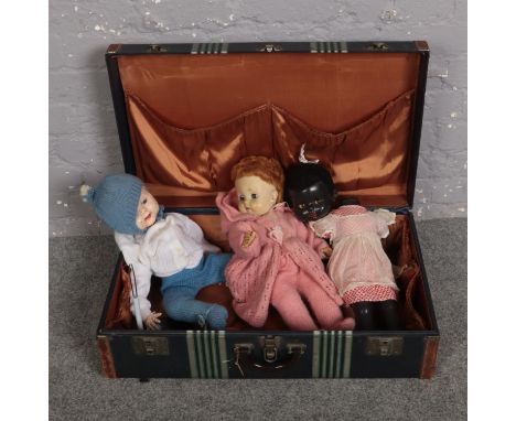 A vintage suitcase with contents of dolls, to include Roddy example.  