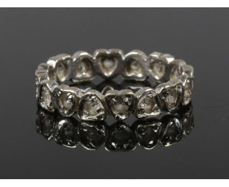 A 9ct white gold eternity ring set with white paste stones, size N.  