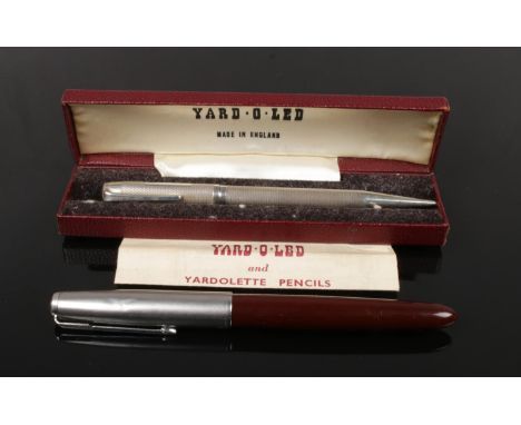 A cased silver Yard O Led pencil with instructions assayed London 1956, along with a Parker fountain pen.  