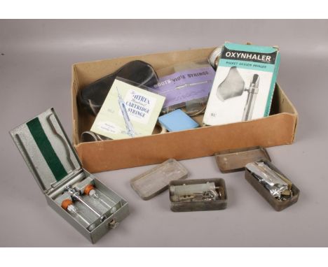 A collection of vintage medical equipment, Sparklets Oxynhaler examples  