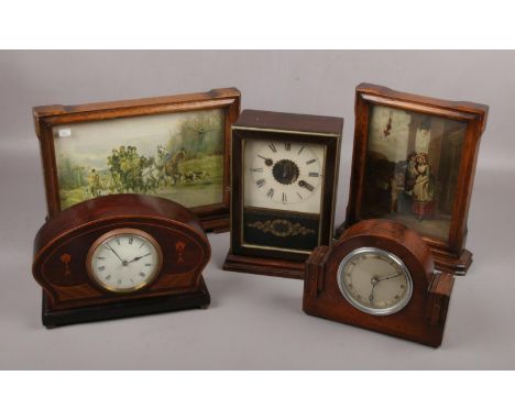 A collection of clocks, to include German alarm clock, French inlaid example, Smiths Cries of London etc.  