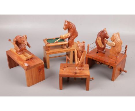 Four mechanical wood carvings; skiing bear, snooker playing bear, golfer and boxing bears  