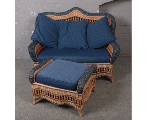 A rattan style conservatory suite consisting of sofa, two arm chairs, foot stool and table.  