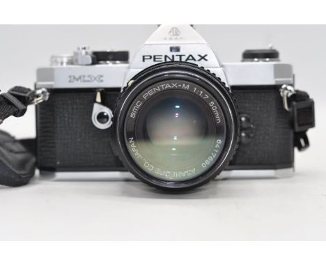 Pentax MX camera with Pentax-M SMC 50mm lens, Pentax-M SMC 28mm lens and Silk mini-pro V digital tripod