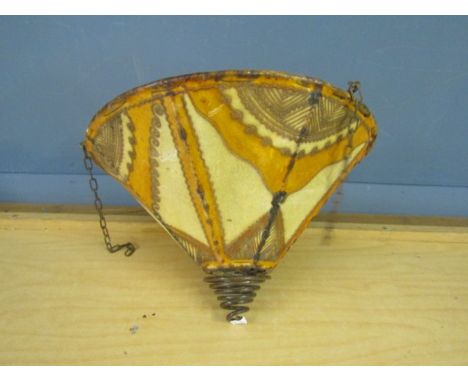 A vintage stitched vellum light shade