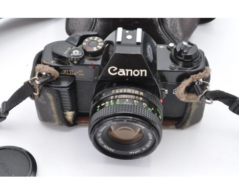 Canon AL-1 SLR camera with lens and Miranda Titan 606 tripod