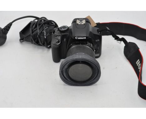 Canon EOS 450D camera with Canon 18-55mm lens and charger.