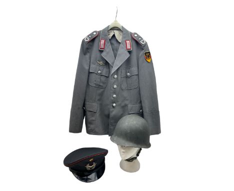 West German helmet steel helmet, together with 1960's peak cap and tunic with German insignias 