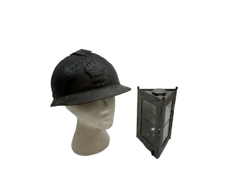 French M26 Genie (engineers) steel helmet with attached comb and helmet plate, together with WWI trench lamp