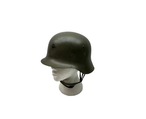 WWII Spanish combat steel helmet model Z, with leather lining and canvas strap, interior D22cm 