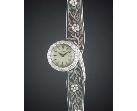 A FINE & RARE LADIES 18K SOLID WHITE GOLD & DIAMOND PIAGET BRACELET WATCHCIRCA 1960s Movement: Manual back wind, signed Piage