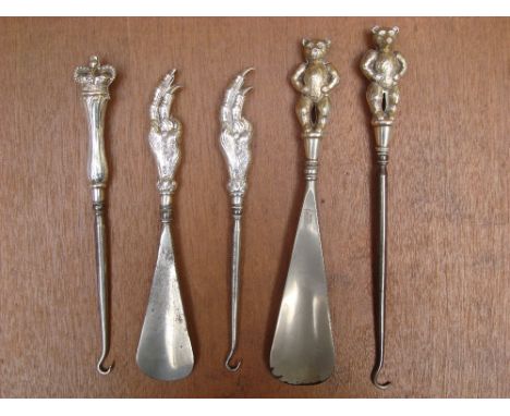 An Edwardian novelty silver mounted button hook and shoe horn, the handles cast as a birds claw, Birmingham, 1909 by Crisford