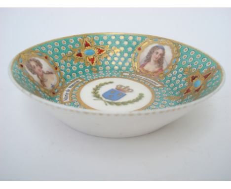 A 19th Century Sevres style 'jewelled' porcelain portrait saucer, the centre painted with the French Royal coat of arms and a