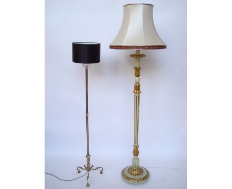A green and gilt painted standard lamp together with a brass standard lamp with octagonal cast stem on three scroll tripod ba