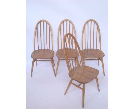 A set of four Ercol beech and elm hoop spindle back kitchen chairs.