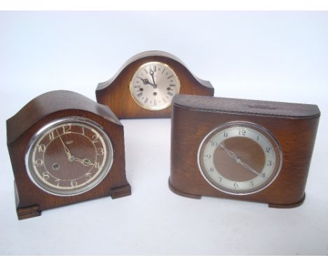 A 1930's oak cased Smiths quarter striking 8 day mantel clock, a coin operated mantel clock and a 1950's Bentima walnut cased