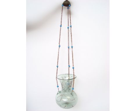 A late 19th Century Ottoman / Syrian pale green glass Mosque lamp, of vase form with three suspension loops, with gilt and bl