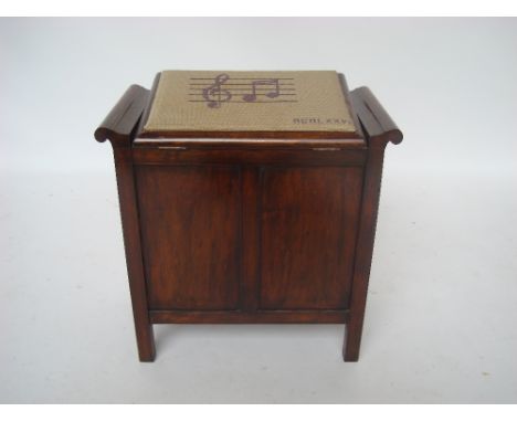 Early 20th Century walnut box piano stool with hinged tapestry covered seat. 