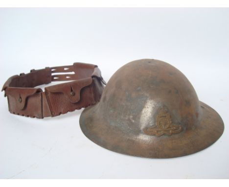 A WWI Royal Artillery tin helmet and 'The Stohwinter' leather bandolier (2). 