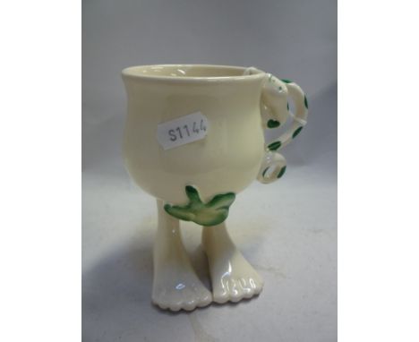 A CARLTONWARE LUSTRE POTTERY WALKING WARE MUG
