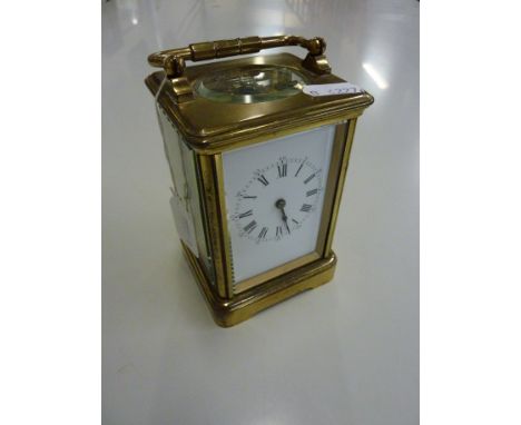 A BRASS CARRIAGE CLOCK, with key