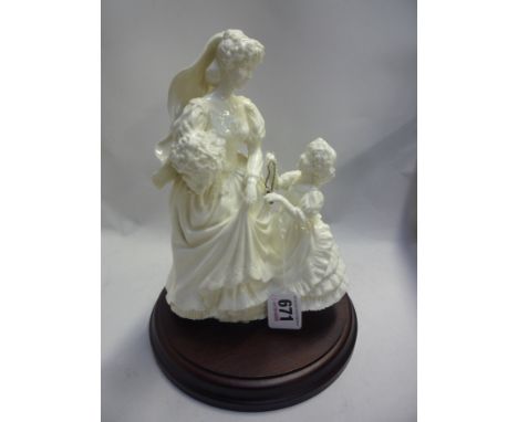 A ROYAL WORCESTER FIGURE GROUP, 'The Wedding Day', with plinth