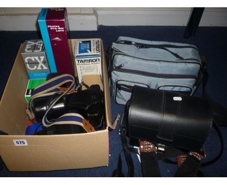 A QUANTITY OF CAMERAS, to include an Olympus OM 10 camera in case,  cased Olympus lens x 3, two flash guns, camera bag etc