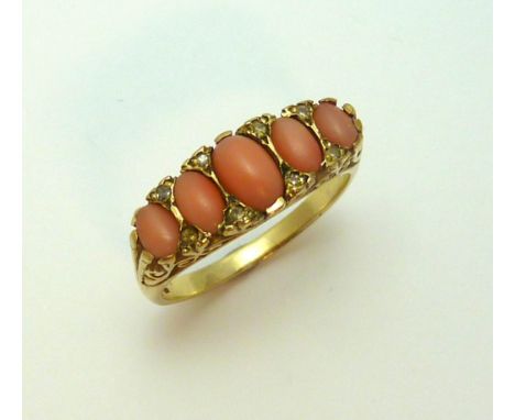 A 9CT GOLD CORAL AND DIAMOND RING, the graduated coral with diamond accents to the fancy scrolling sides, hallmarks for Birmi