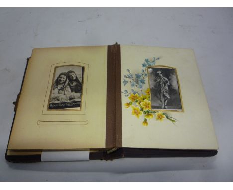AN EDWARDIAN LEATHER BOUND POCKET PHOTOGRAPH ALBUM, with card pages printed with flower sprays, containing mainly Ogden's por