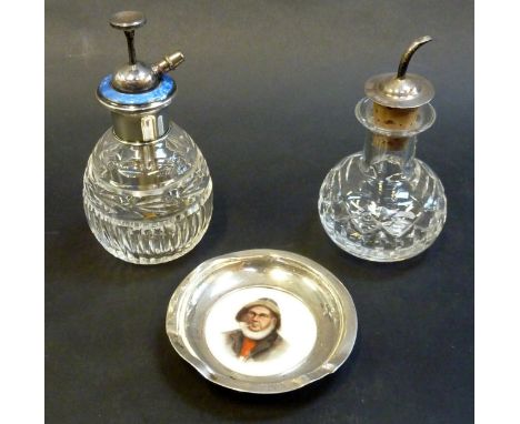 A SILVER ENAMEL BOTTLE, a silver topped bottle and a silver dish with painted fisherman (3)