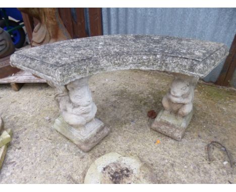 A COMPOSITE GARDEN BENCH, with squirrel detail to the stands